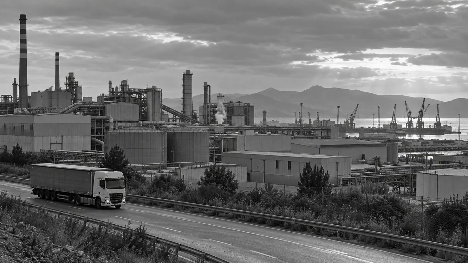 Factories and freight traffic line an industrial area in Sagunto, Spain. (AI-generated image / EconoTimes)