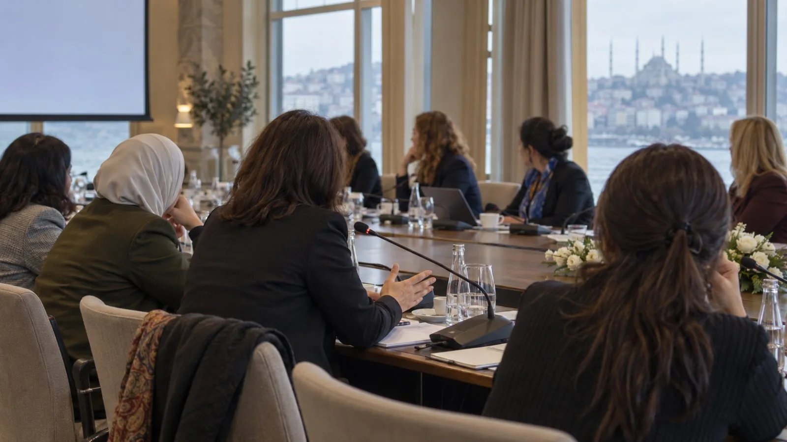 Women delegates listen during a mediation conference in Istanbul, Türkiye. (AI-generated image / EconoTimes)