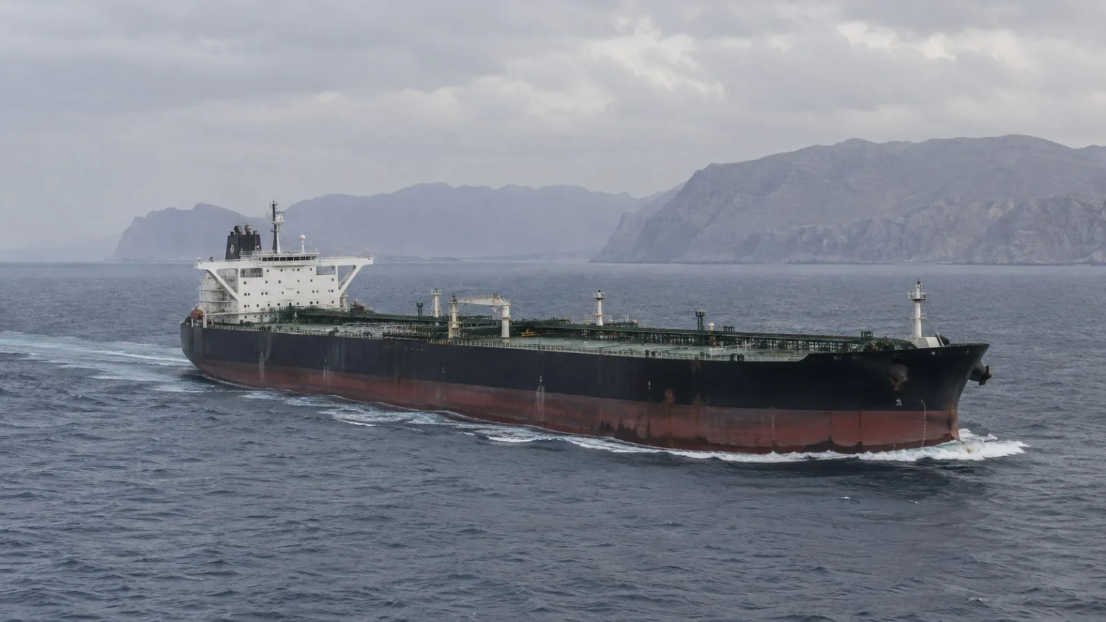 An oil tanker sails off the Musandam coast near Khasab, Oman, in the Gulf of Oman. (AI-generated image / EconoTimes)