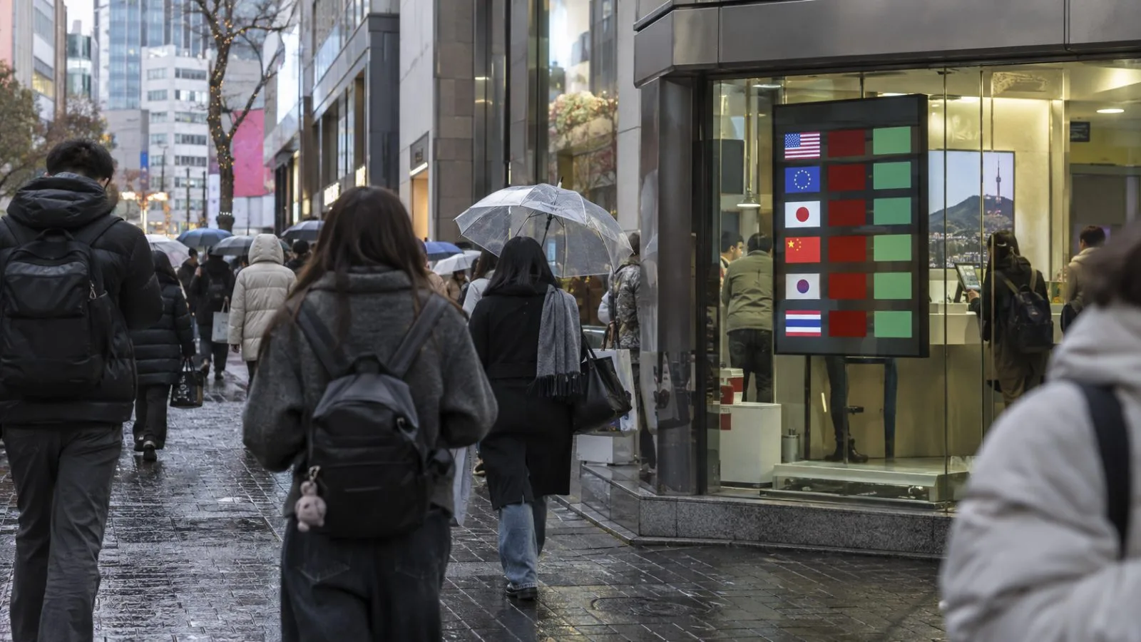 Pedestrians pass a currency exchange storefront on Myeongdong's shopping street in Seoul. (AI-generated image / EconoTimes)