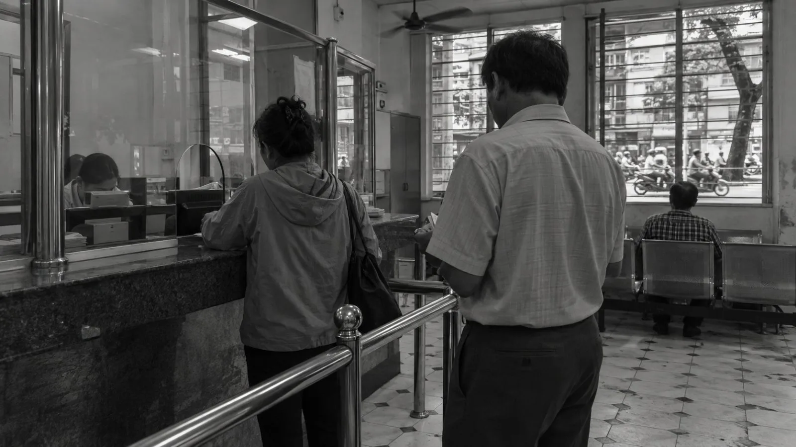 Customers wait at a remittance payout counter in Ho Chi Minh City, Vietnam. (AI-generated image / EconoTimes)