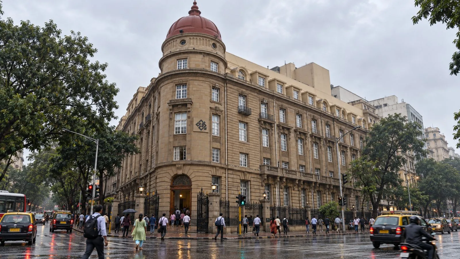 Pedestrians pass a bank entrance on a rain-darkened street in Mumbai, India. / EconoTimes.ai