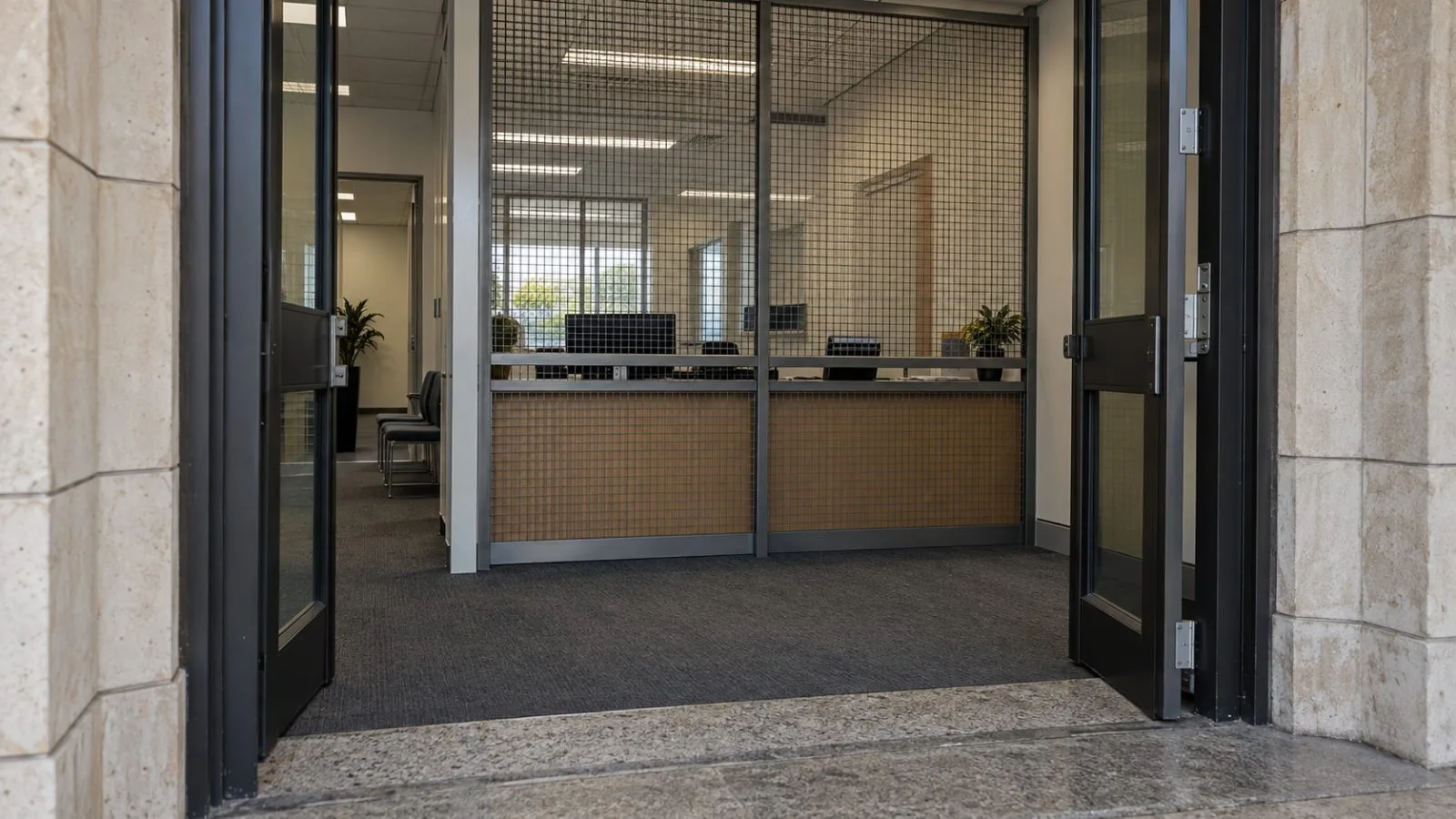 A security screen is visible through the entrance of a state minister's office in Perth, Australia. (AI-generated image / EconoTimes)