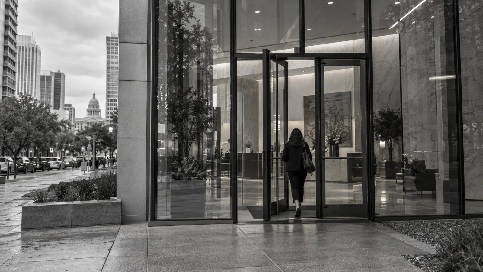 The office entrance on West Fifth Street catches soft morning light in downtown Austin, Texas. (AI-generated image / EconoTimes)