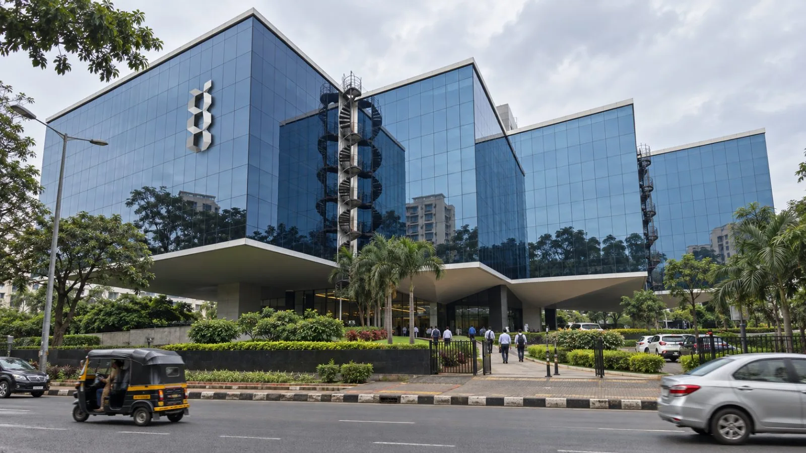Employees enter Larsen & Toubro’s headquarters in Mumbai, India, on an overcast morning. / EconoTimes.ai
