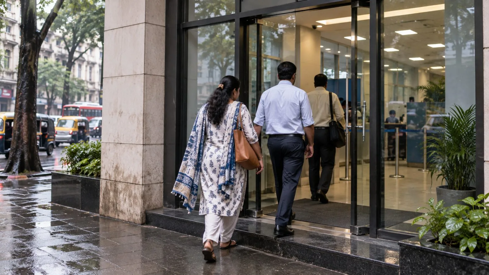 Customers enter an HDFC Bank branch in Mumbai, India, on an overcast morning. / EconoTimes.ai