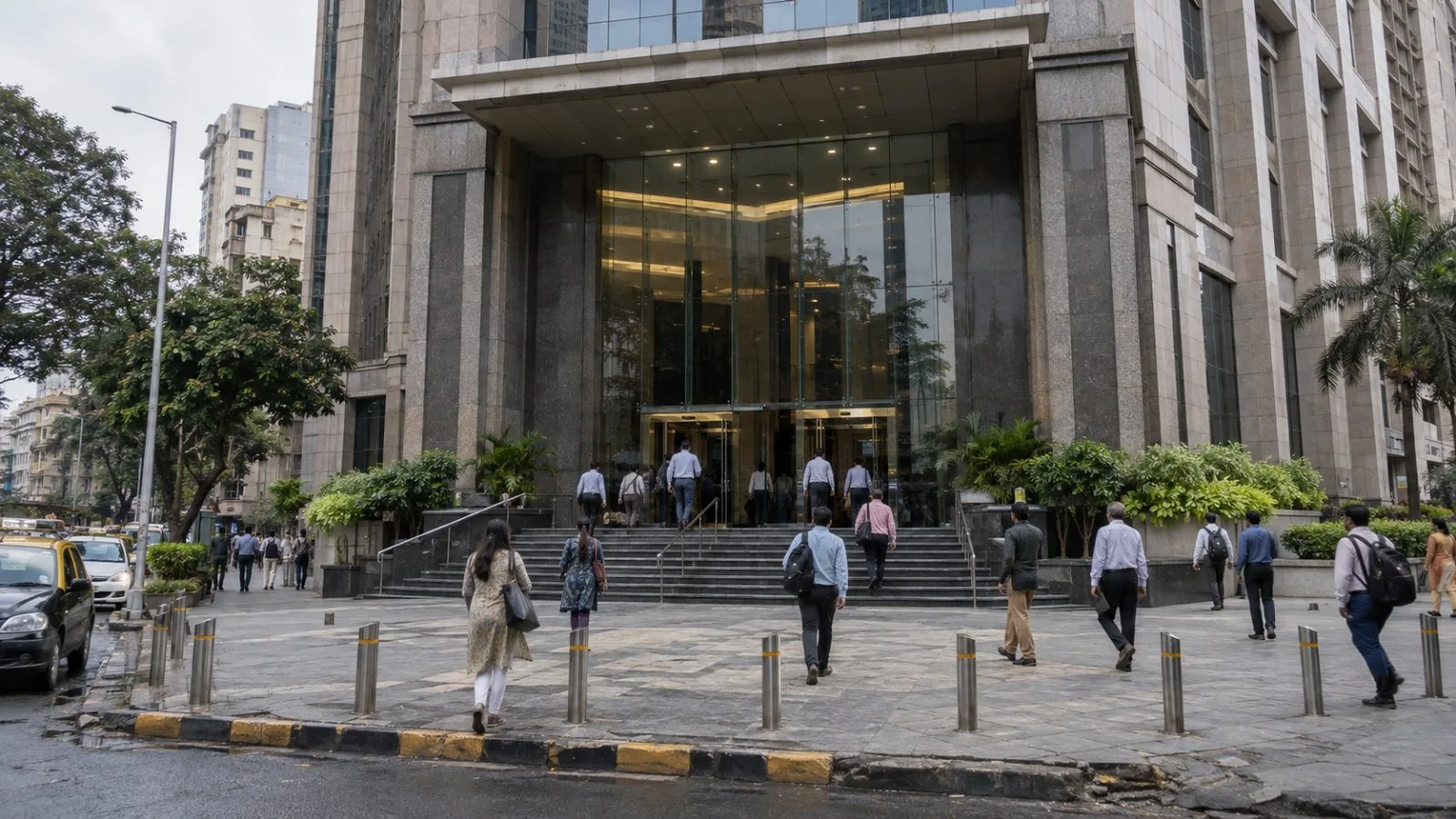 Pedestrians pass Union Bank Bhavan in Mumbai on an overcast afternoon. (AI-generated image / EconoTimes)