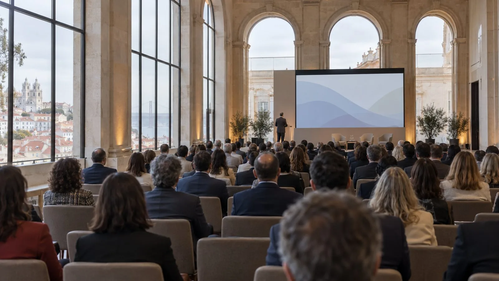 Attendees face a conference stage during Meridian 2026 in Lisbon, Portugal. (AI-generated image / EconoTimes)