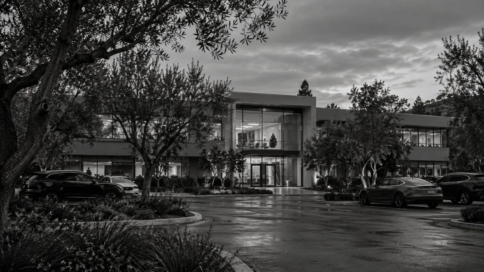 A low-rise office building and parking lot sit along Willow Road in Menlo Park, California. (AI-generated image / EconoTimes)