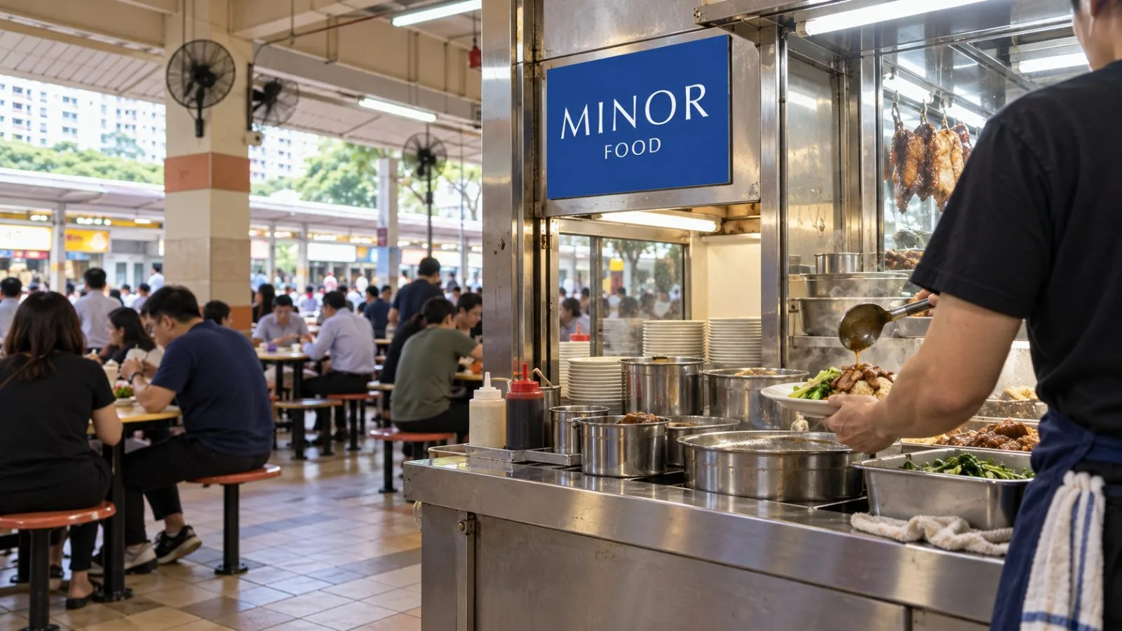 A cook plates a lunch order at Maxwell Food Centre in Singapore. / EconoTimes.ai