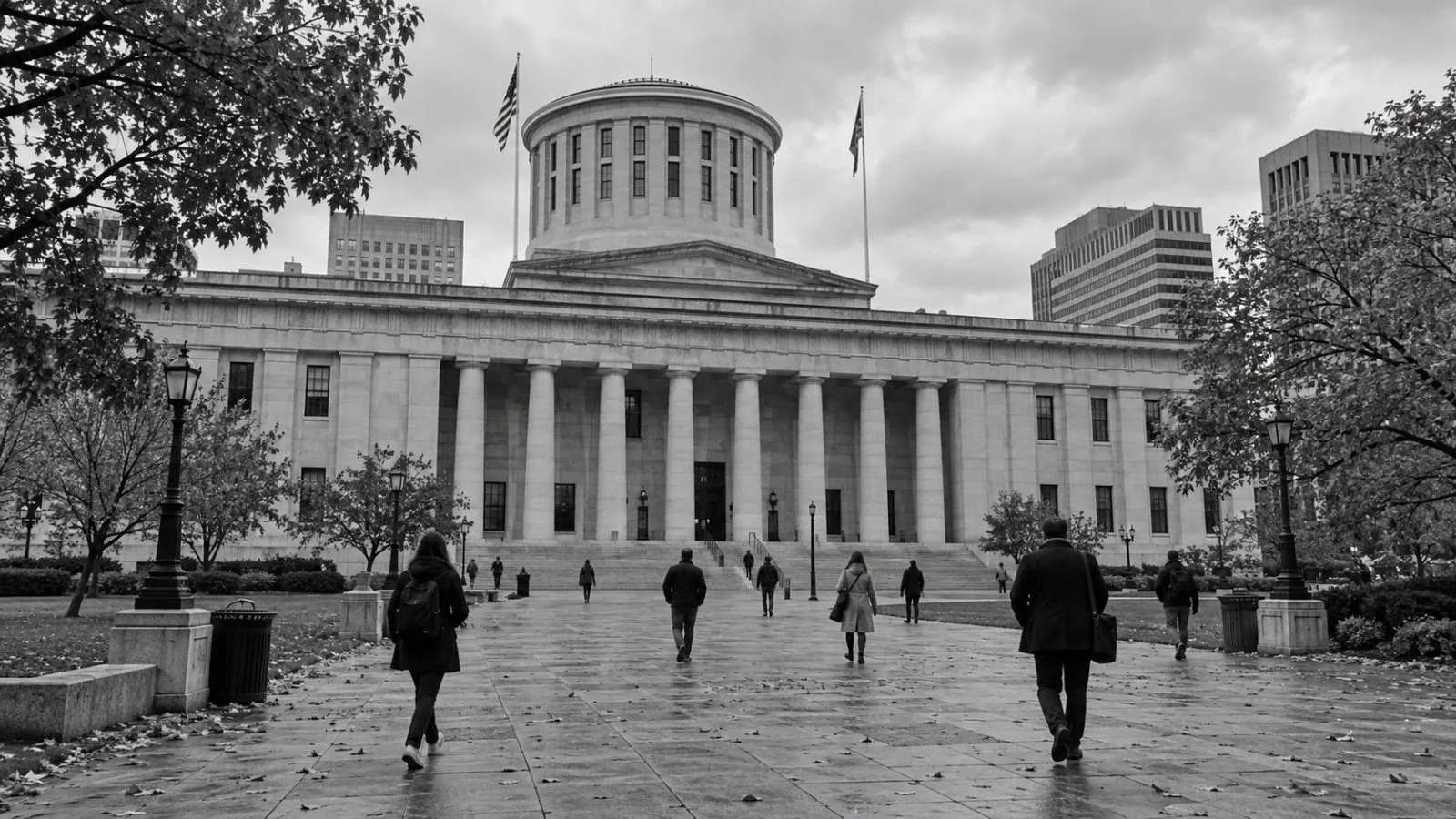 Pedestrians cross the plaza outside the Ohio Statehouse in Columbus on an overcast day (AI-generated image / EconoTimes)