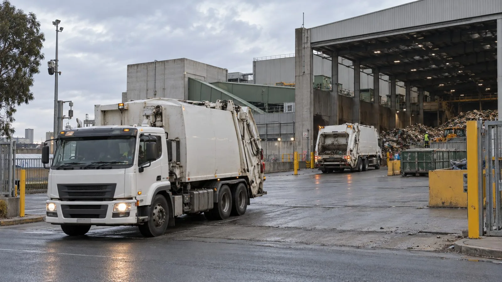 Refuse trucks enter a waste transfer station in West Melbourne, Australia. (AI-generated image / EconoTimes)