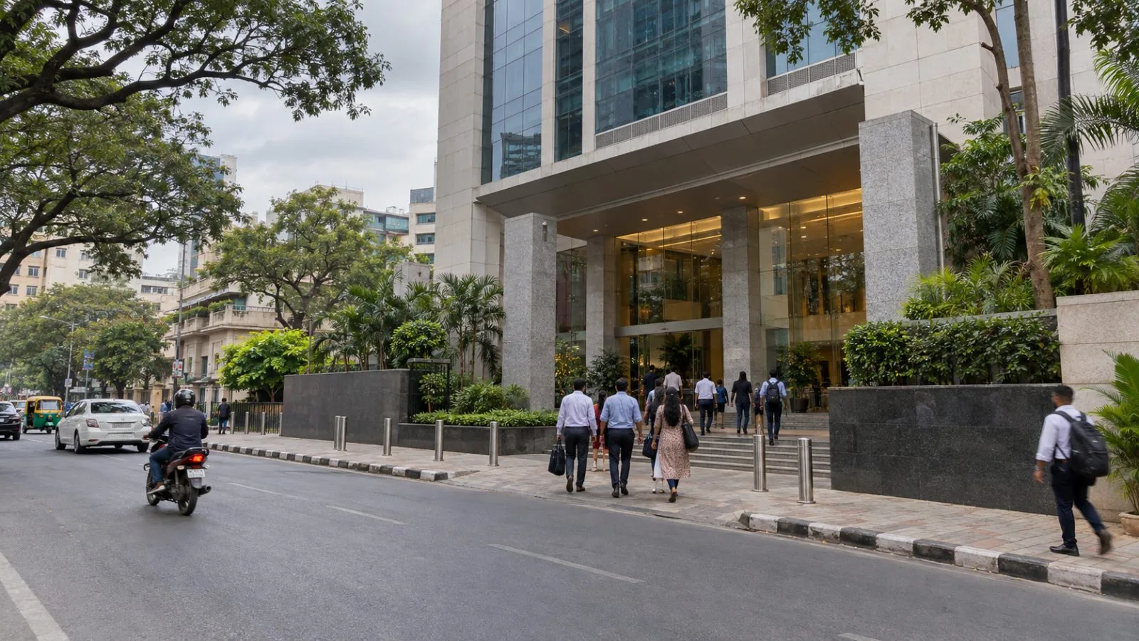 Pedestrians pass Janardhan Towers on Residency Road in Bengaluru's Richmond Town district. (AI-generated image / EconoTimes)