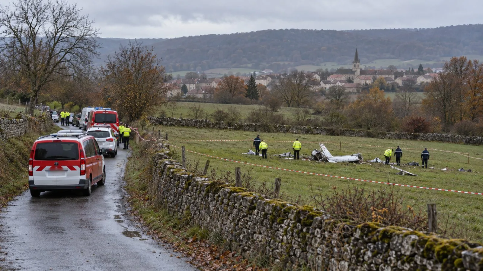 Emergency vehicles stand beside a cordoned crash search area near Rogeville, France. (AI-generated image / EconoTimes)