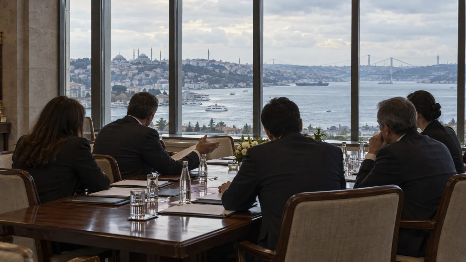 Anonymous officials meet in Istanbul as late afternoon light falls across a conference room overlooking the Bosphorus. (AI-generated image / EconoTimes)