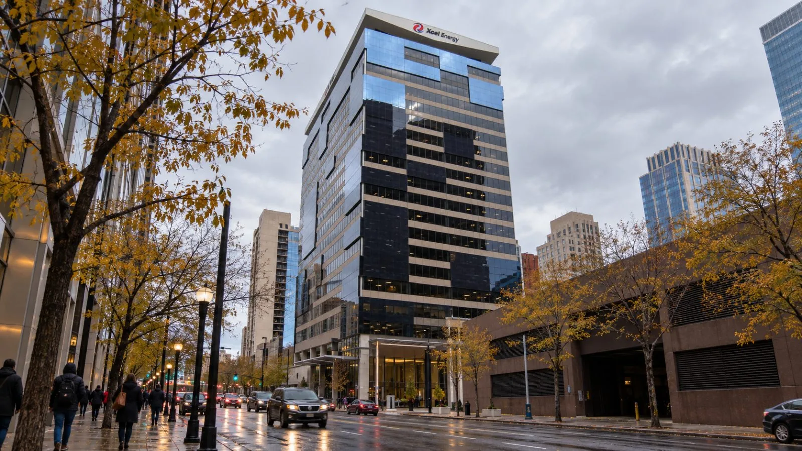 Pedestrians pass the glass office tower housing Xcel Energy’s headquarters on Nicollet Mall in Minneapolis. / EconoTimes.ai