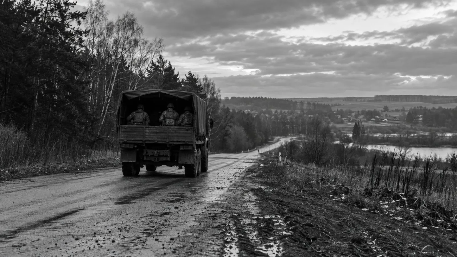 A military vehicle travels along a wooded road near Sumy, Ukraine. (AI-generated image / EconoTimes)
