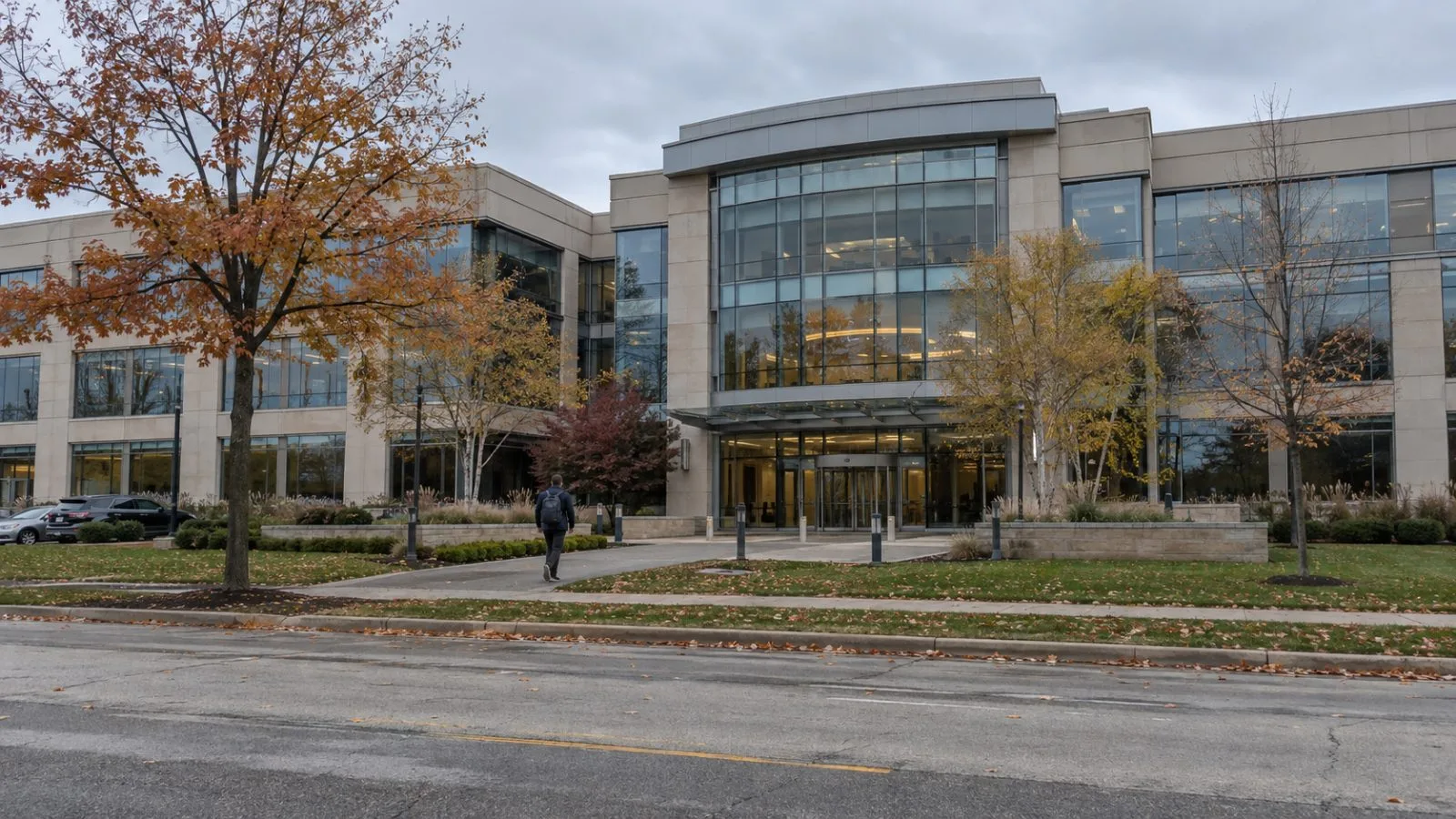A pedestrian passes the exterior of First Trust's headquarters in Wheaton, Illinois. (AI-generated image / EconoTimes)