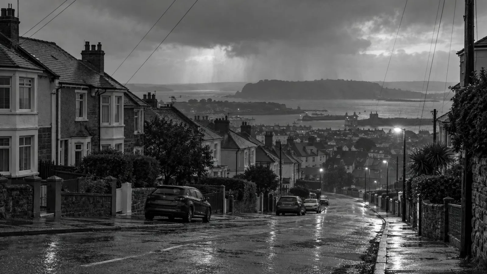 Rain-darkened homes and overhead power lines line a residential street in Plymouth, southwest England. (AI-generated image / EconoTimes)