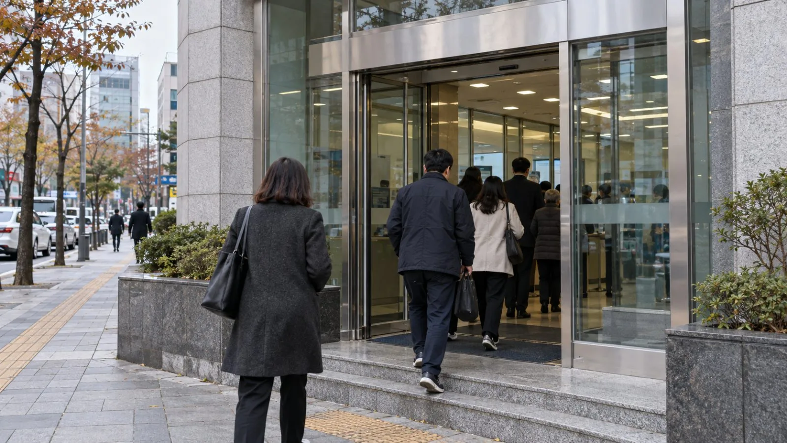 Customers enter a bank branch in Seoul, South Korea / EconoTimes.ai