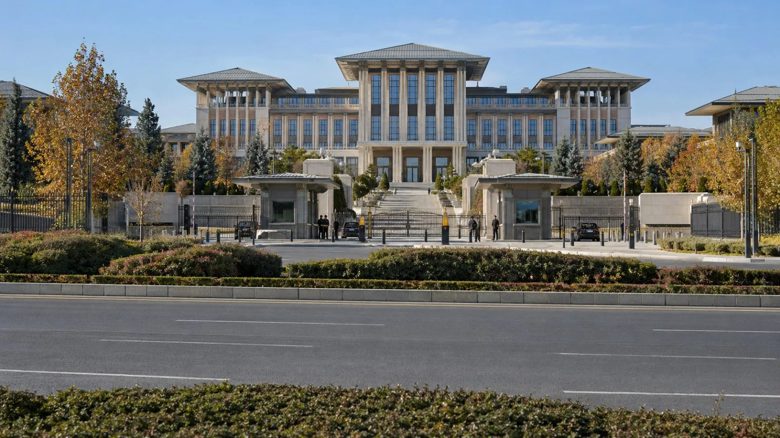 Ankara's Presidential Complex approach road runs past government buildings on a clear autumn morning. (AI-generated image / EconoTimes)