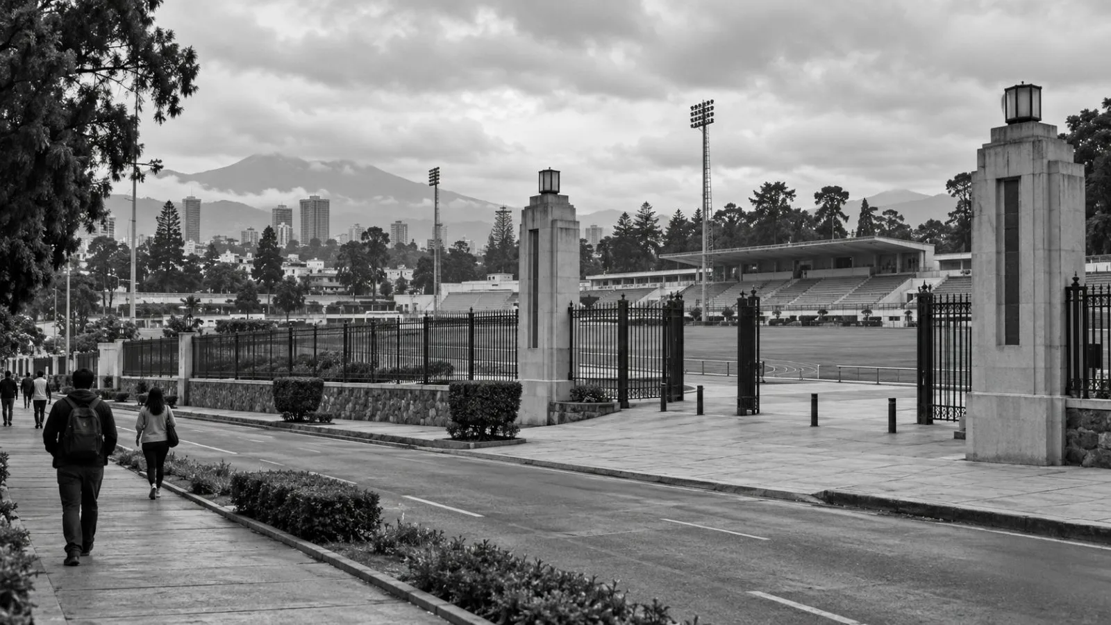 The entrance to Campo Marte sports complex stands under overcast skies in Guatemala City. (AI-generated image / EconoTimes)