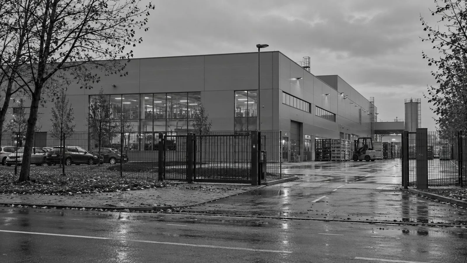 The Flytronic factory stands behind an industrial gate in Gliwice, Poland. (AI-generated image / EconoTimes)