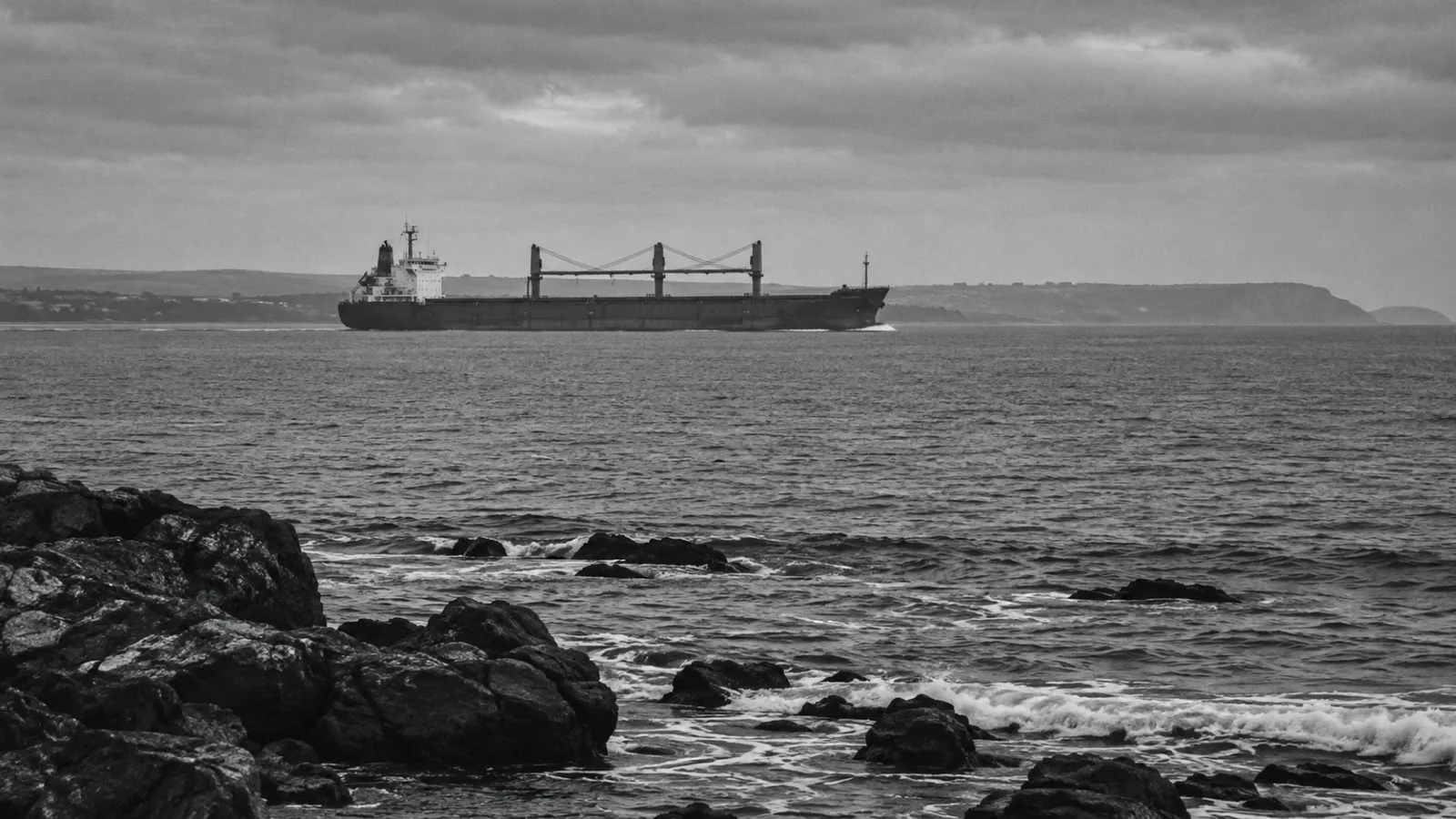 A cargo ship moves through the Black Sea off Bulgaria’s coast under gray morning light (AI-generated image / EconoTimes)