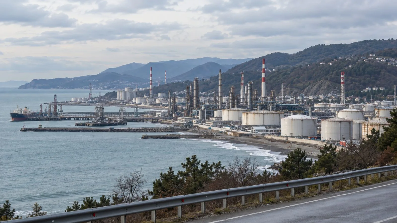 Refinery stacks and storage tanks rise above the Tuapse refinery in Tuapse, Russia (AI-generated image / EconoTimes)
