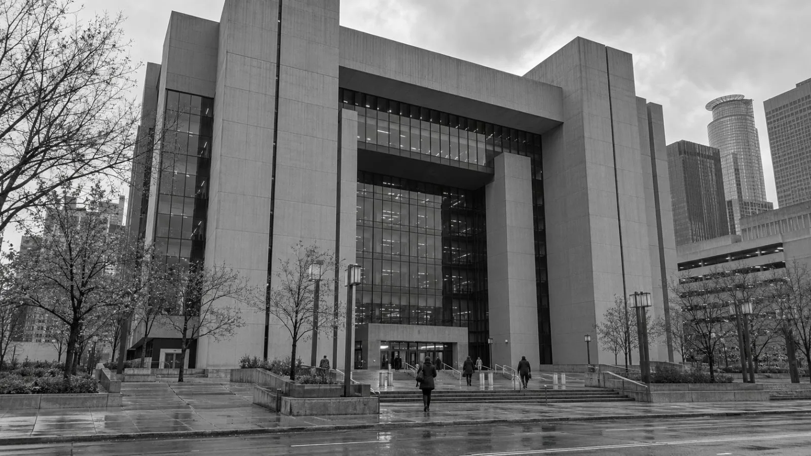 Visitors enter the Hennepin County Government Center in Minneapolis on an overcast autumn morning. (AI-generated image / EconoTimes)