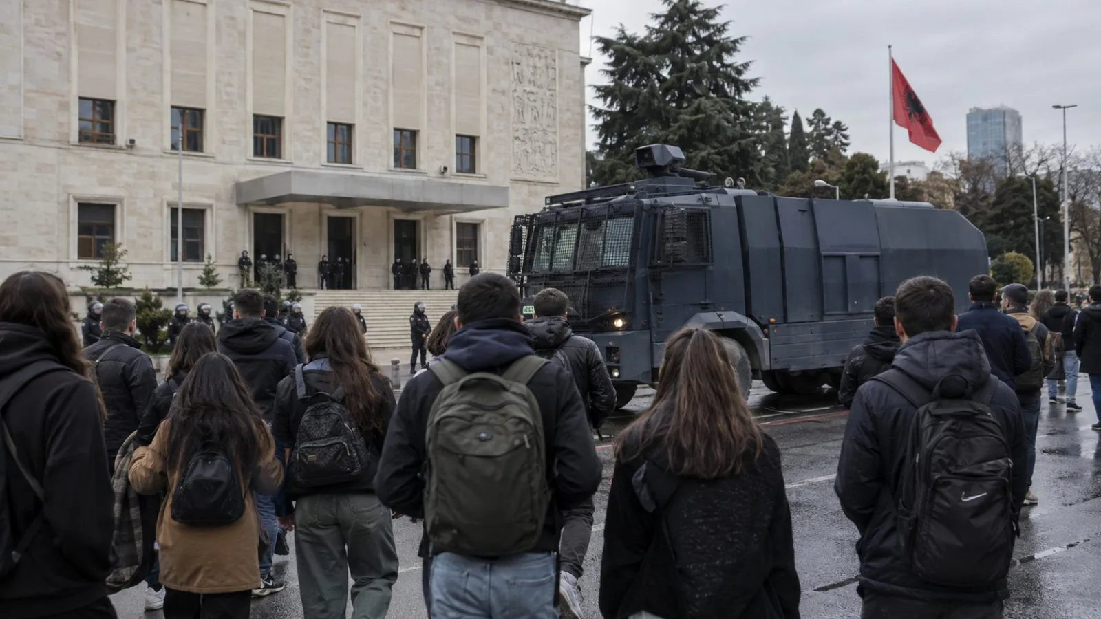 Students gather beside a police water cannon outside Albania’s Parliament in Tirana. (AI-generated image / EconoTimes)