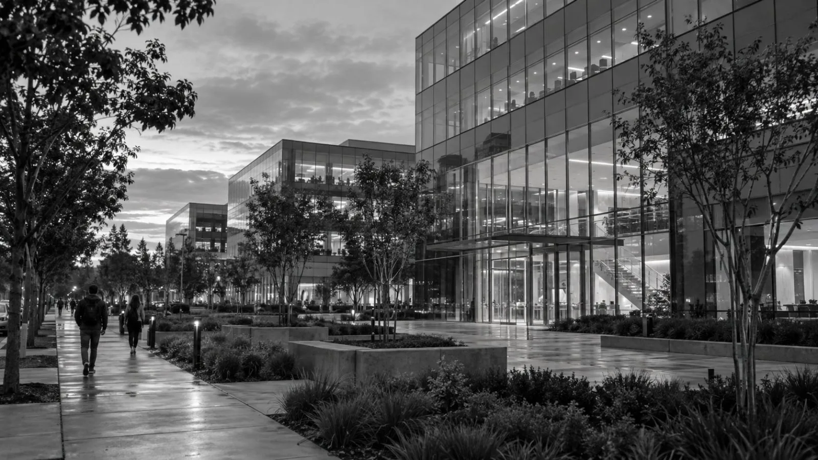 Office workers walk past a glass campus building in Santa Clara, California. (AI-generated image / EconoTimes)