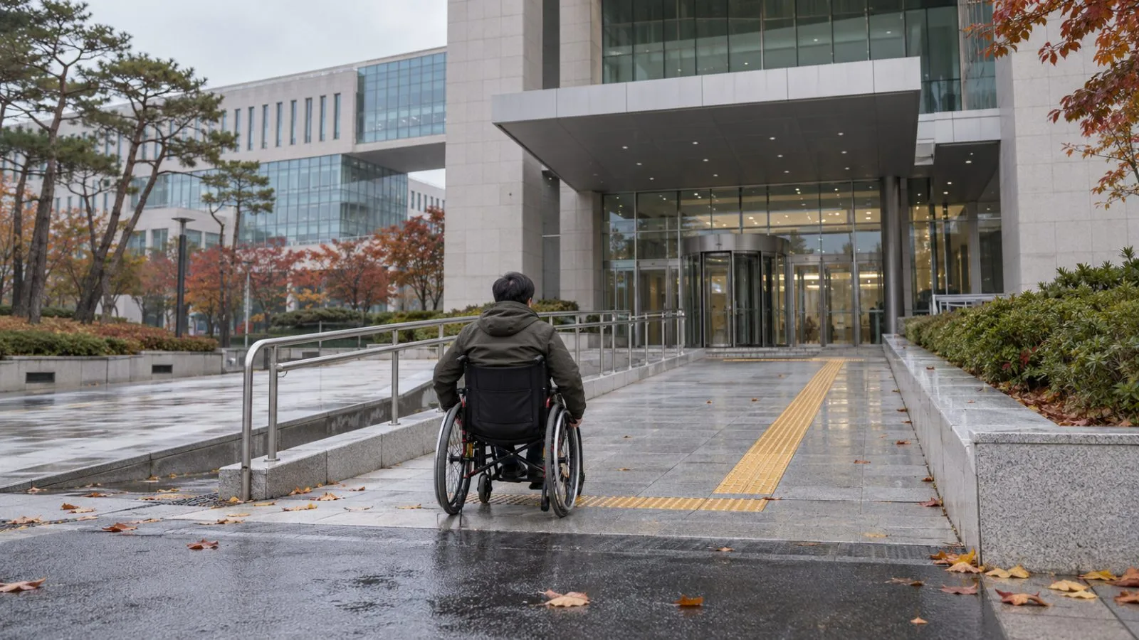 A wheelchair user approaches the Ministry of Health and Welfare complex in Sejong, South Korea. (AI-generated image / EconoTimes)