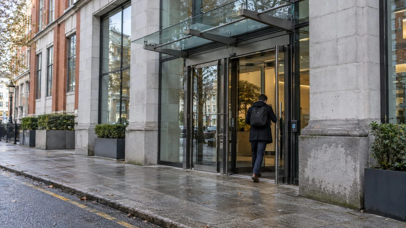A passerby enters The Capel Building on Mary's Abbey in Dublin, Ireland. (AI-generated image / EconoTimes)
