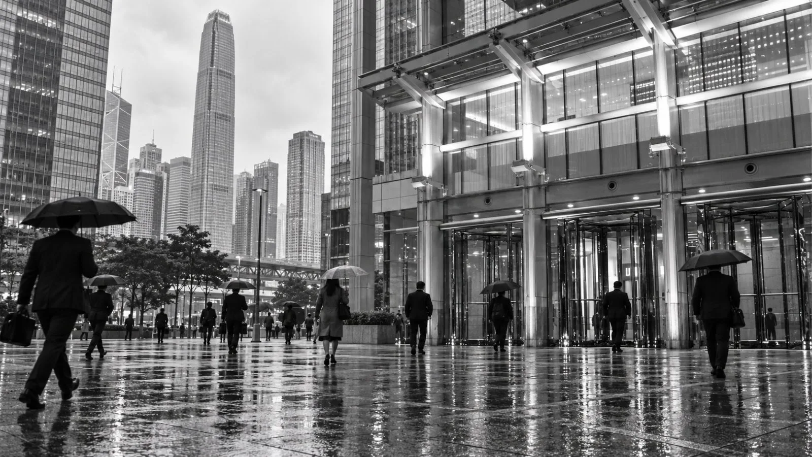 Commuters cross the plaza outside the Hong Kong Monetary Authority in Central, Hong Kong. / EconoTimes.ai