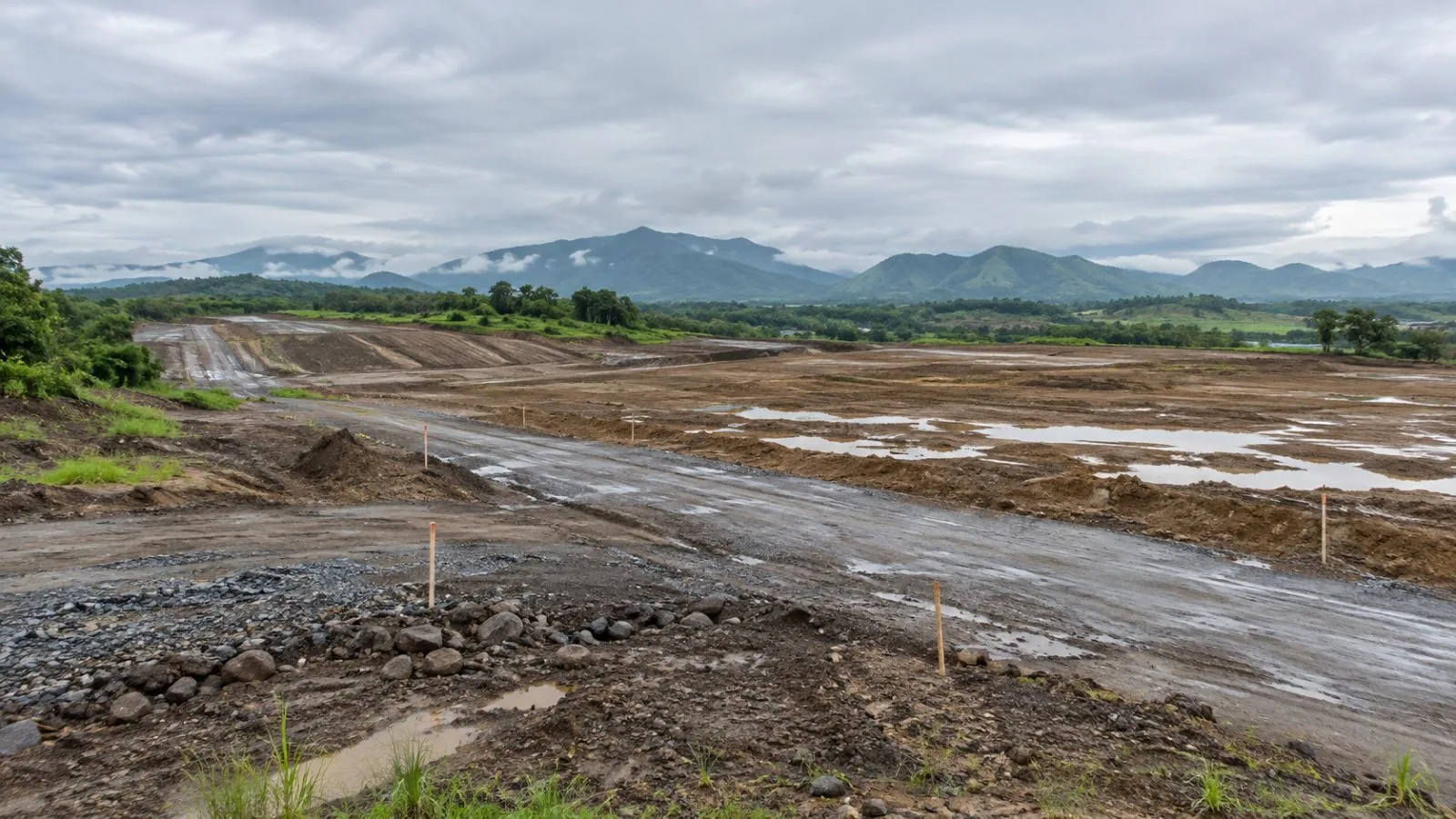 A graded lot and access road mark the proposed industrial zone in New Clark City, Tarlac. (AI-generated image / EconoTimes)