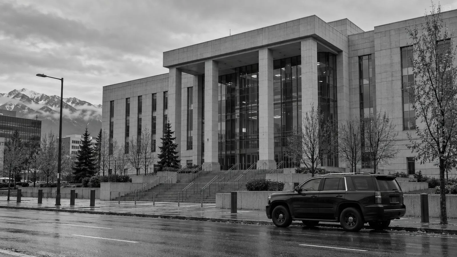 The federal courthouse stands beneath low clouds in downtown Anchorage, Alaska. (AI-generated image / EconoTimes)