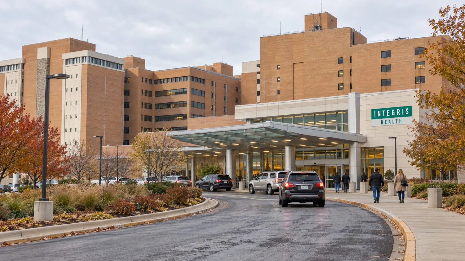 Patients enter a hospital building in Oklahoma City, Oklahoma, on an overcast morning. / EconoTimes.ai