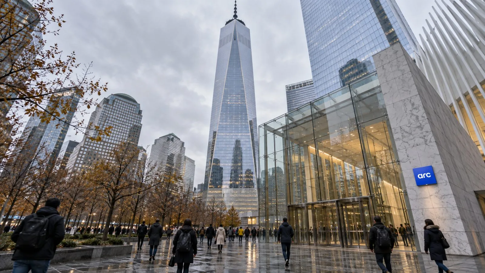 Pedestrians pass the entrance of One World Trade Center in New York City. / EconoTimes.ai