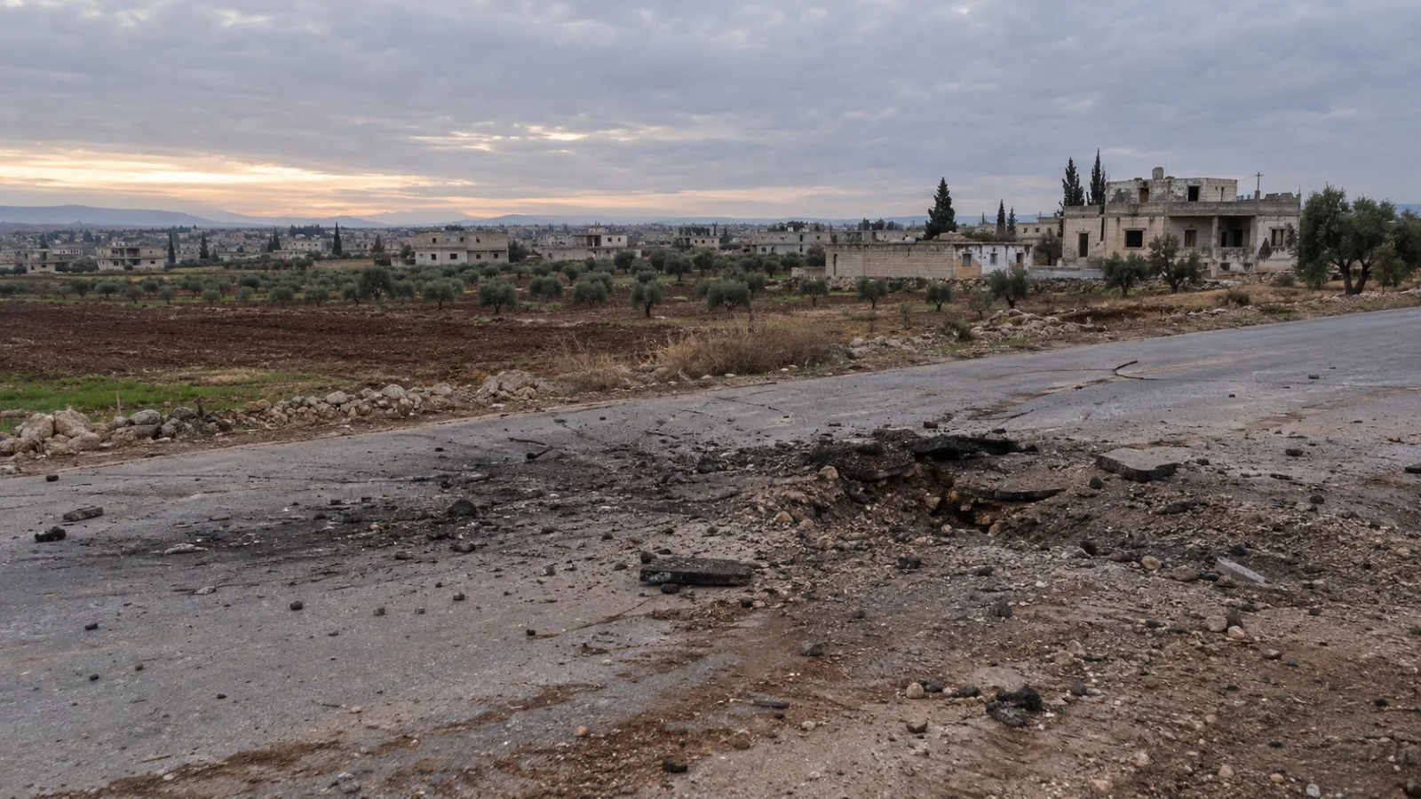 A rural road runs past low concrete homes in the Daraa countryside in southern Syria. (AI-generated image / EconoTimes)