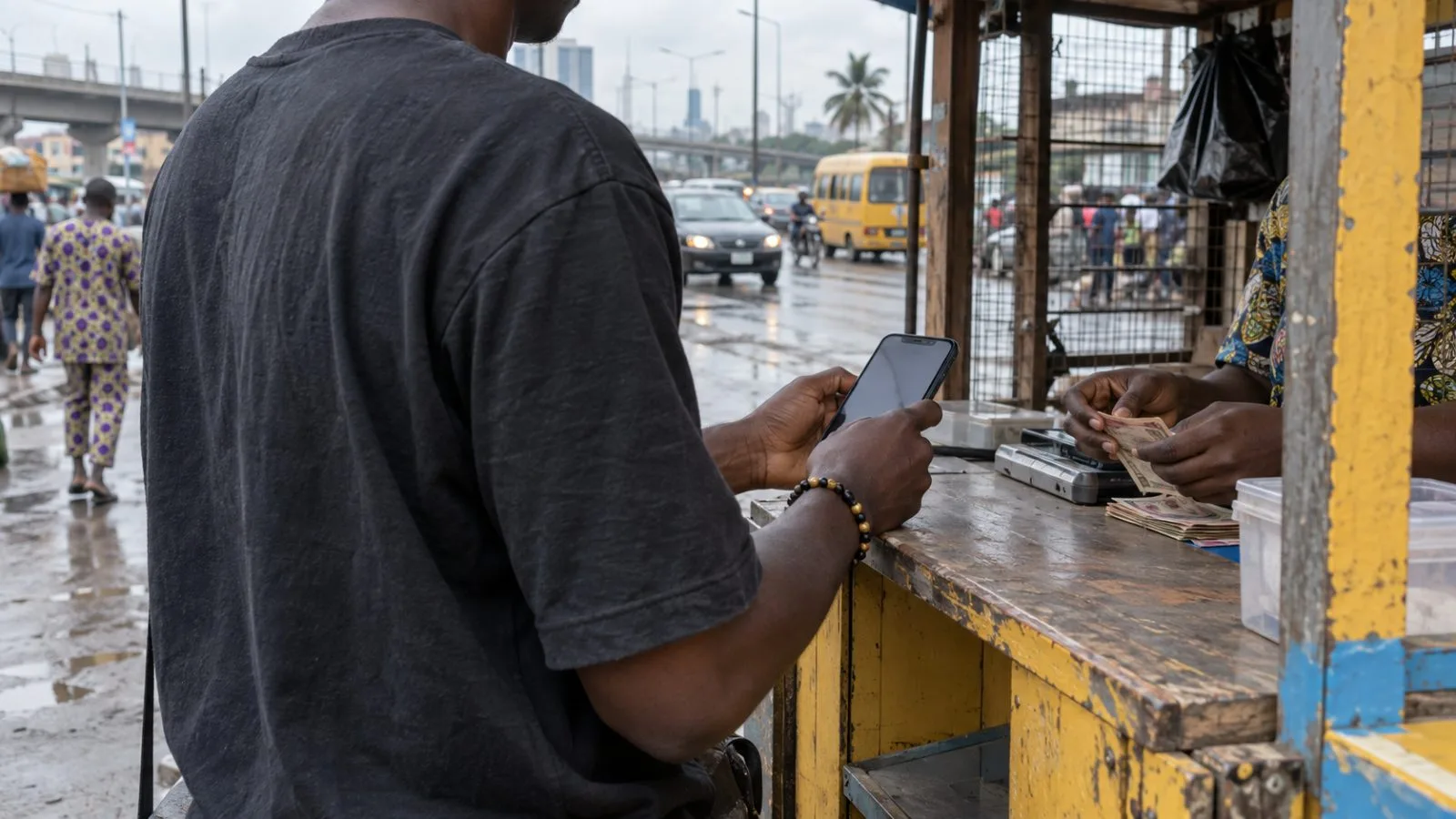A customer uses a mobile-money kiosk along a busy street in Lagos, Nigeria (AI-generated image / EconoTimes)