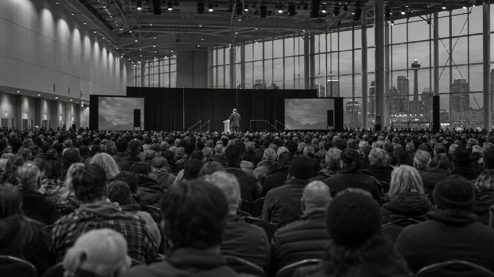Attendees fill the BMO Centre as an evening political rally unfolds in Calgary, Alberta (AI-generated image / EconoTimes)
