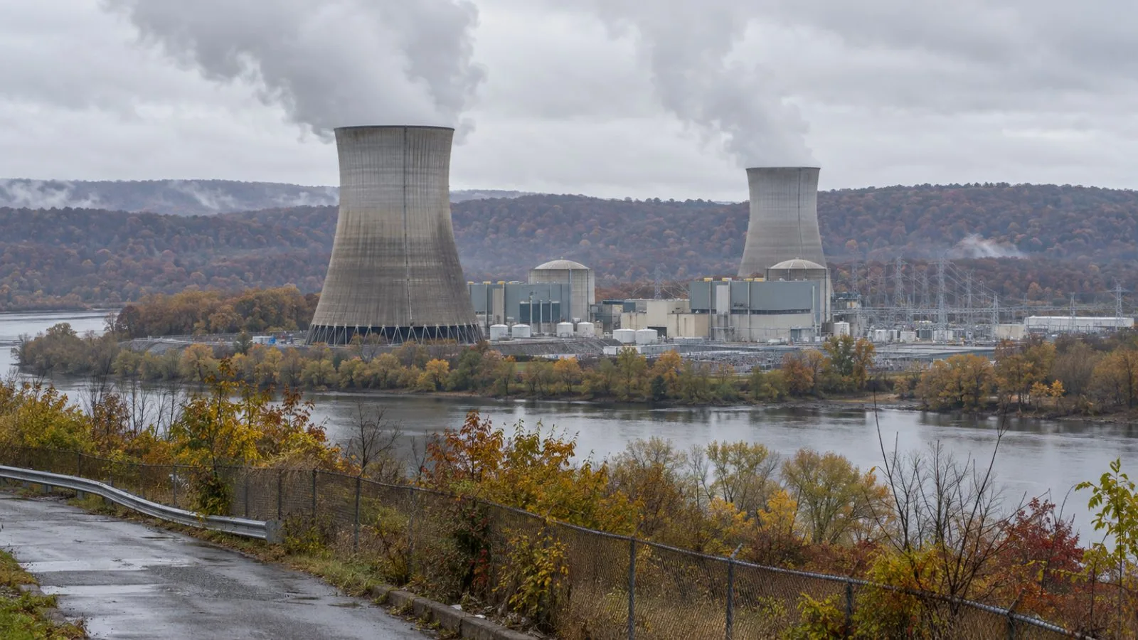 Cooling towers rise above the Susquehanna nuclear station near Berwick, Pennsylvania. (AI-generated image / EconoTimes)