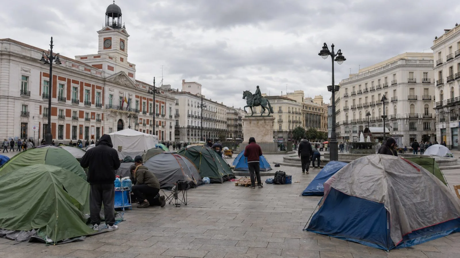 Tents stand in a housing protest encampment at Puerta del Sol in Madrid. (AI-generated image / EconoTimes)