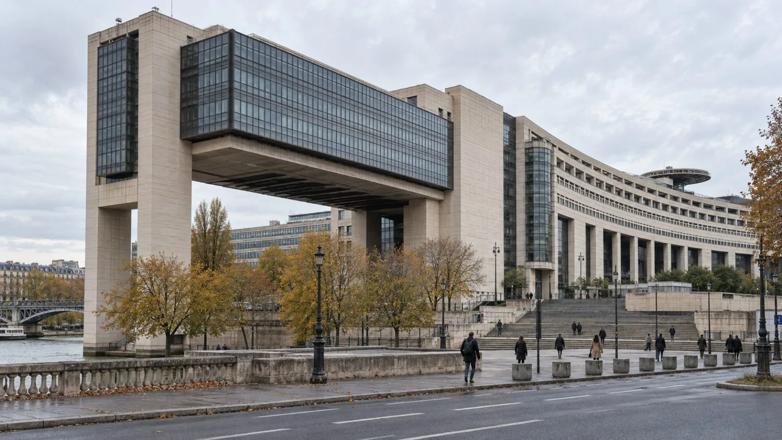 The French Finance Ministry overlooks the Seine at Bercy in Paris under a gray morning sky. (AI-generated image / EconoTimes)