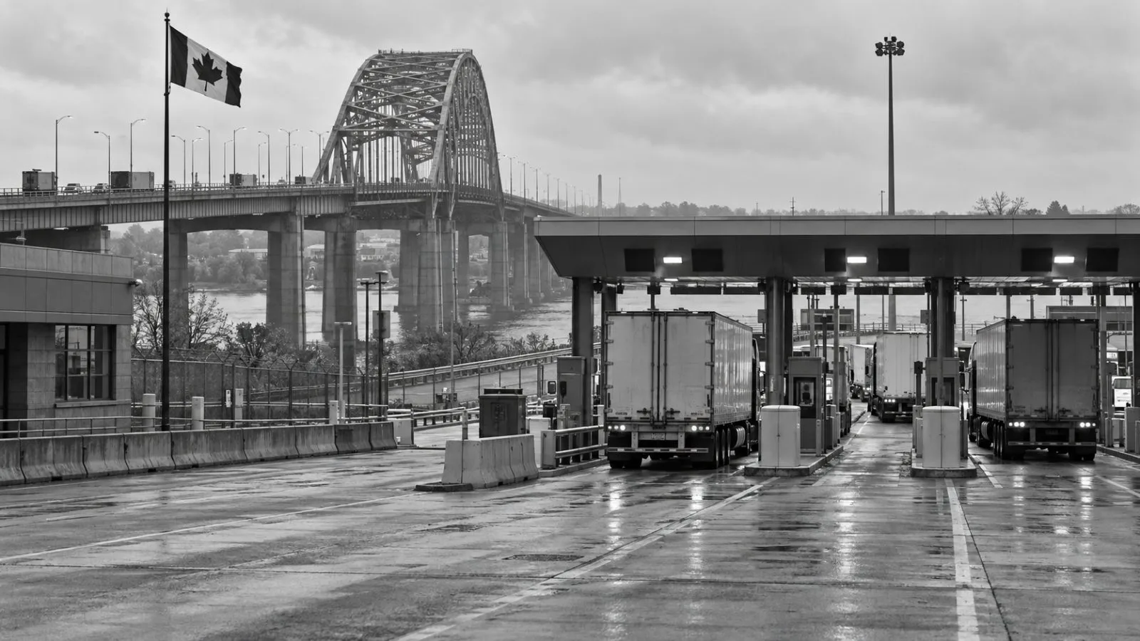 Freight trucks move through Canadian border lanes at the Peace Bridge in Fort Erie, Ontario. (AI-generated image / EconoTimes)