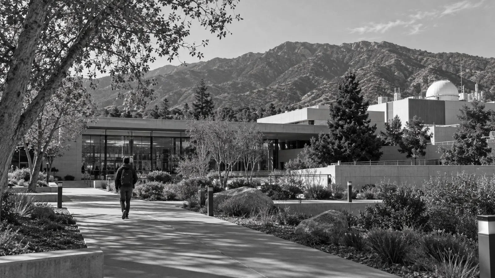 Staff walk toward a research building at NASA’s Jet Propulsion Laboratory in California. (AI-generated image / EconoTimes)