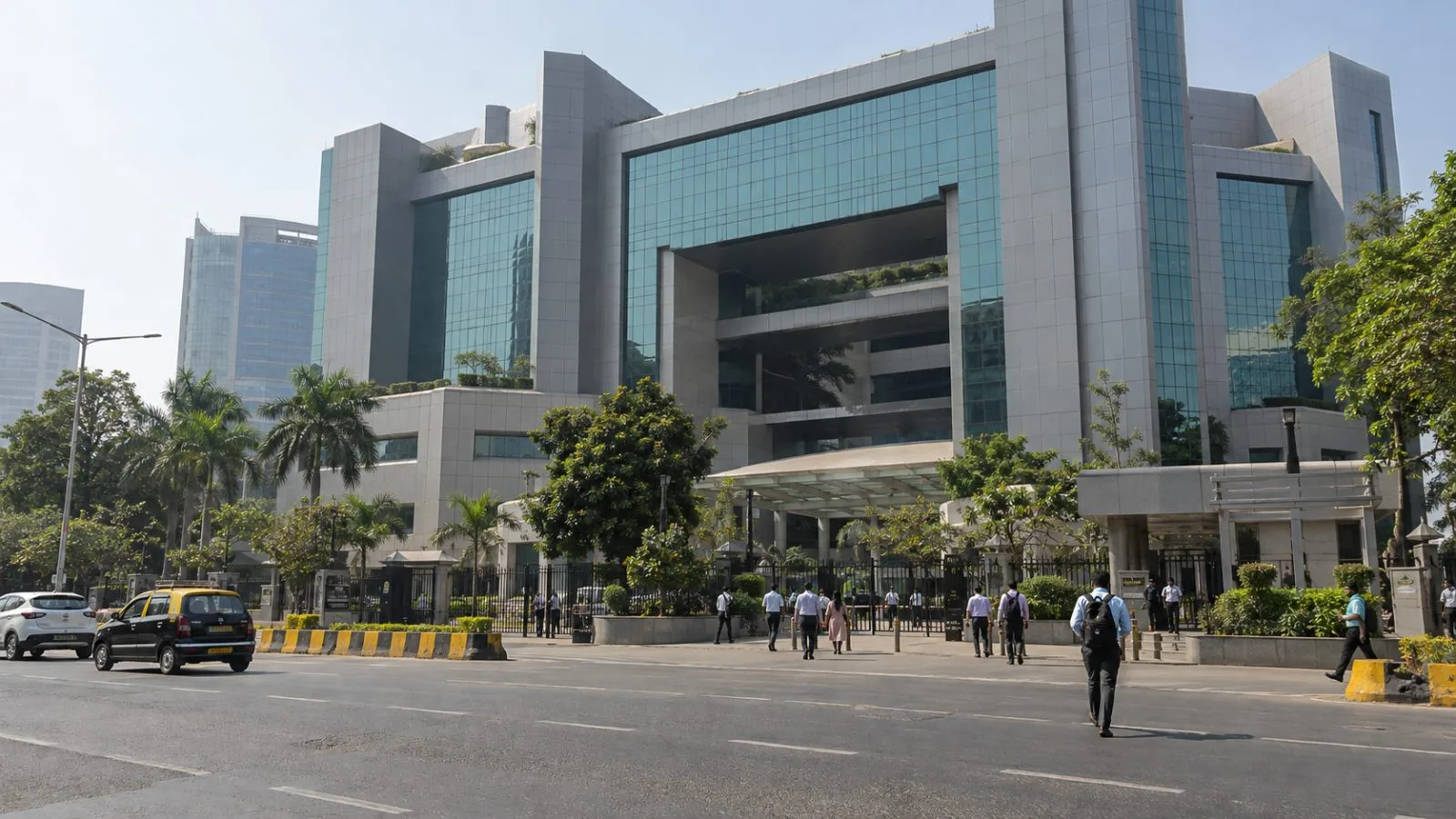Commuters cross outside the National Stock Exchange at Bandra-Kurla Complex in Mumbai. (AI-generated image / EconoTimes)