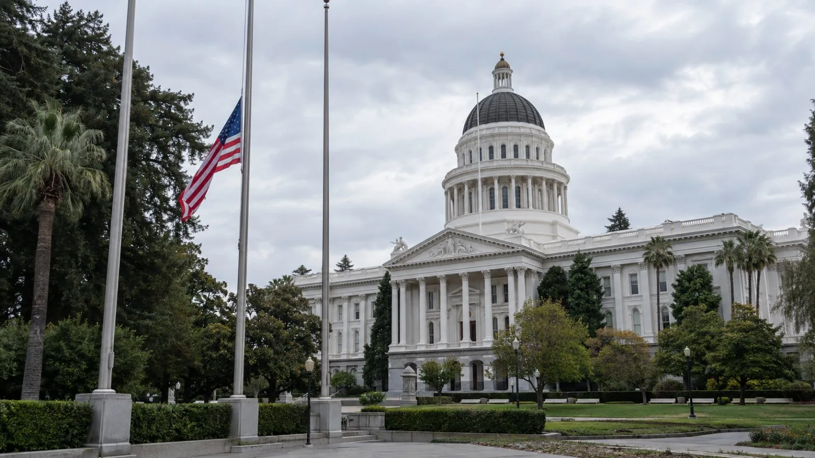 A flag flies at half-staff outside the California State Capitol in Sacramento. (AI-generated image / EconoTimes)