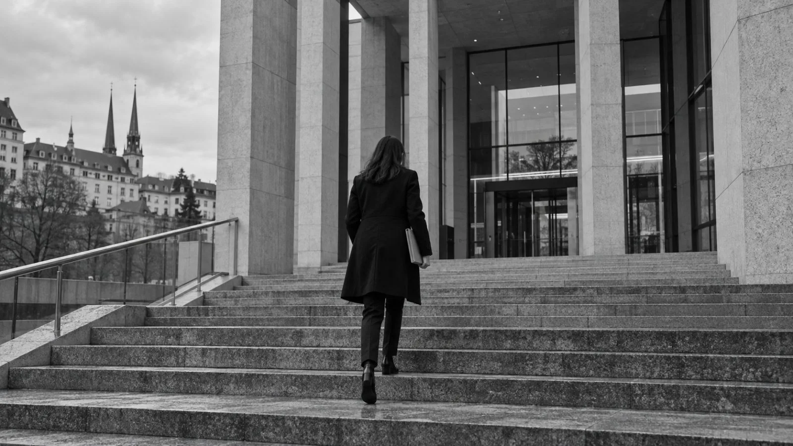 Pedestrians pass Luxembourg City's courthouse on an overcast morning. (AI-generated image / EconoTimes)